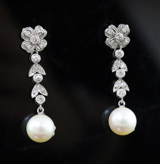 A pair of mid 20th century white metal, cultured pearl and diamond cluster set drop earrings, 33mm.